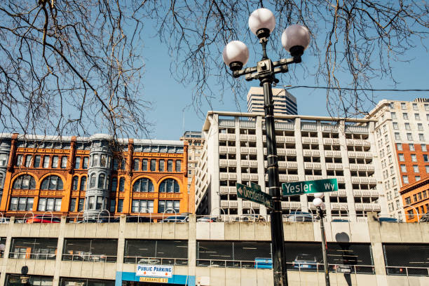 view of buildings to the north of the Occidental Ave S and Yesler Way sign in Seattle's Pioneer Square neighborhood