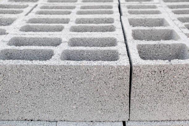 istock Pallet of Concrete Cinder Blocks, Grey Uniformed brick Shapes building material. New for use  on construction site in Israel. 1475387901