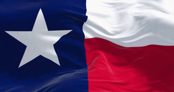 primer plano de la bandera del estado de texas ondeando en el viento - lone star symbol fotografías e imágenes de stock