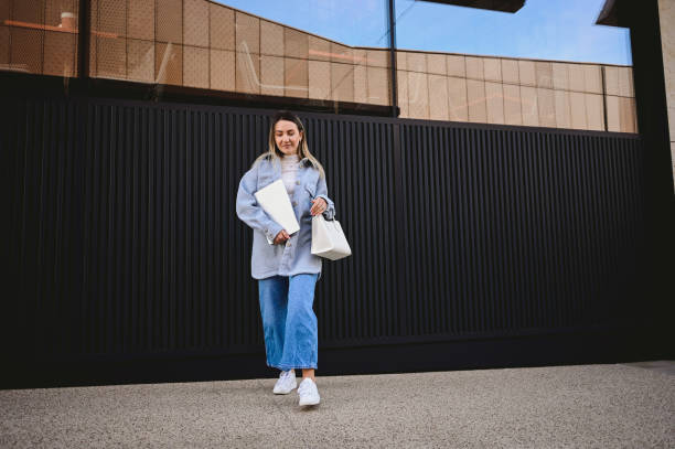 istock walking woman in a retail place. 1475391500