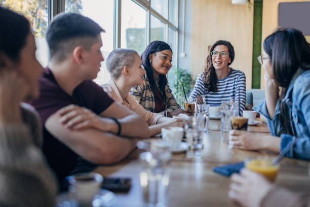 istock Friends sitting together in cafe 1475392878