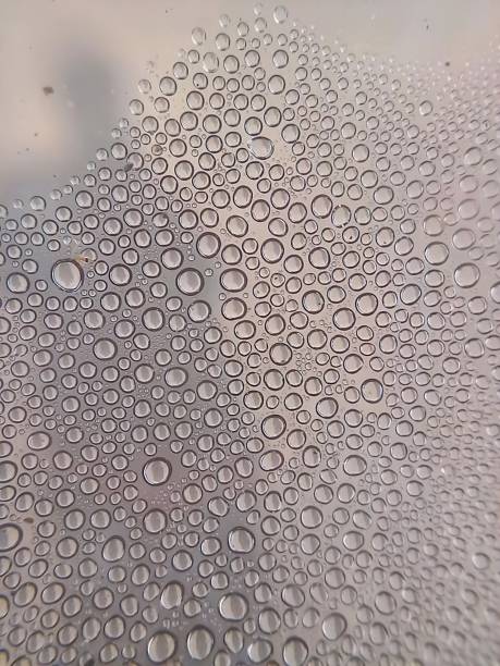 istock Tiny dewdrops on the glass in closeup 1475392930