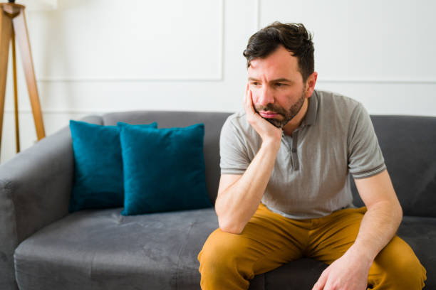 istock Upset sad man with a lot of problems alone at home 1475394207