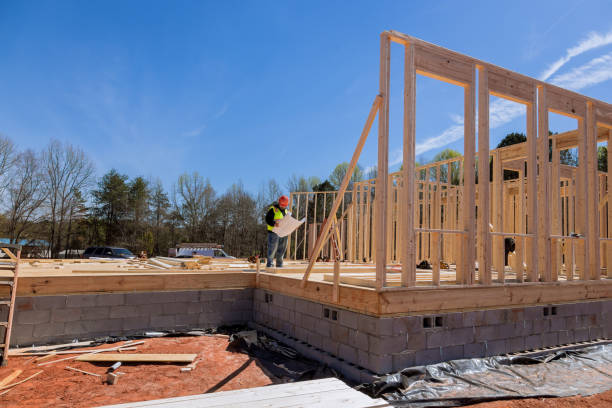 istock When a construction project is underway safety inspector checks the quality of work being performed on site using construction blueprint 1475394227
