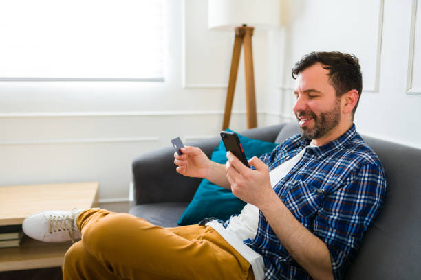istock Happy man using his smartphone doing online shopping 1475394283