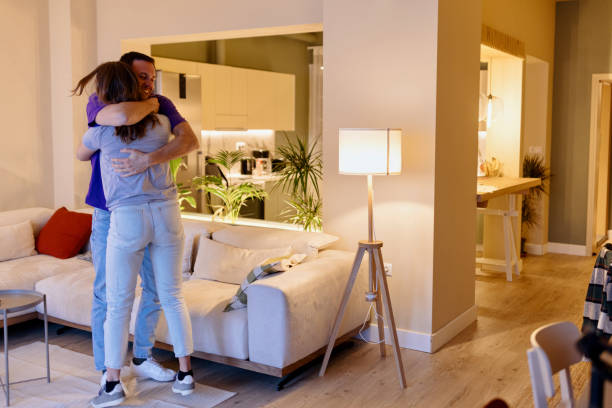 istock Young couple being happy at home 1475397403