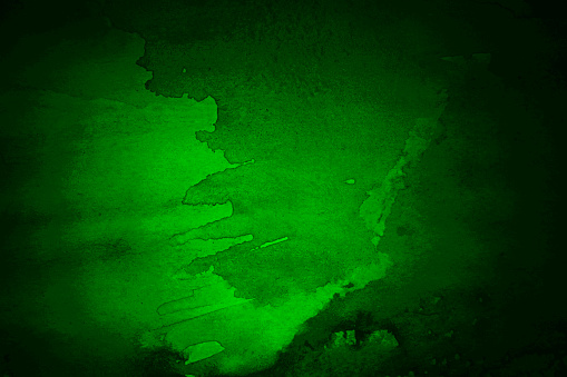 Black green abstract watercolor drawing. Light spot. Dark art background for design. Grunge. Blob, daub. Scary, spooky, creepy or fantasy, mystic.