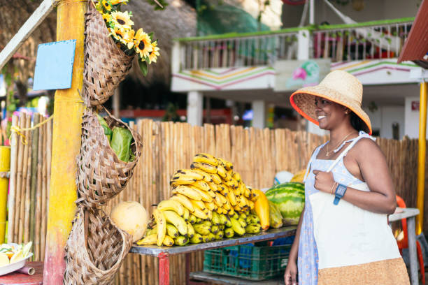 istock Young Woman with reusable bag in a plastic-free fruit store 1475398678