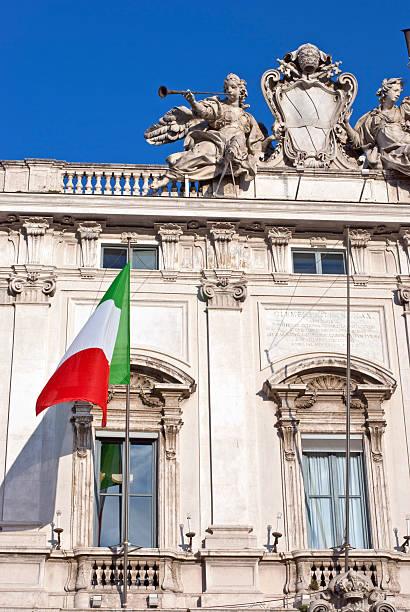 About Rome: Consulta, Italian Politics, Flag, Piazza Quirinale / Roman Beauty Rome, Italy - The Consulta Palace, house of the Constitutional Court of the Italian republic. In Piazza del Quirinale, Roma, Italy. Architect: Ferdinando Fuga. quirinal palace stock pictures, royalty-free photos & images