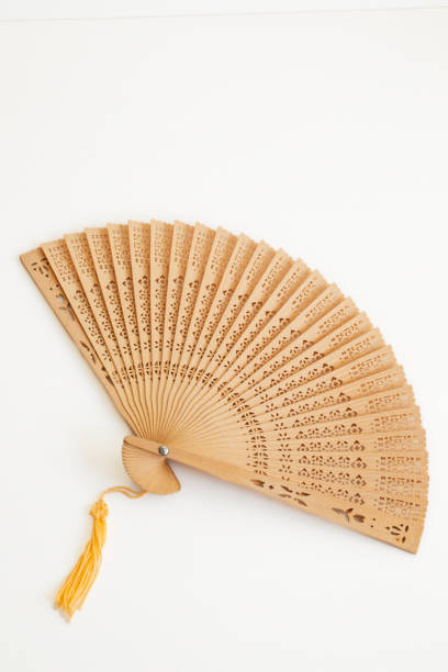 istock Wooden Hand Fan with cutout design 1475399736