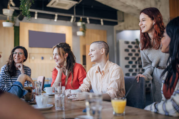 istock Friends sitting together in cafe 1475399828