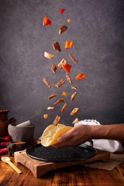 istock Falling Fajita Taco on hand 1475404172