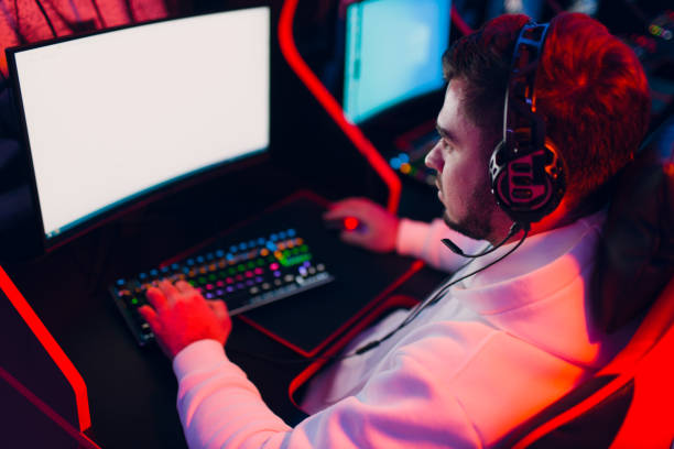 istock Guy playing gaming game on computer at game club 1475404633