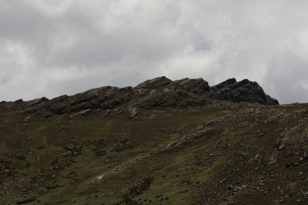 istock Cloudy landscape of mountains 1475407630