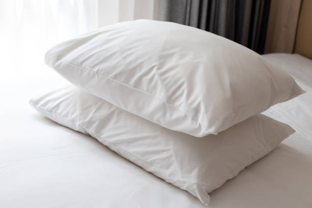 istock Bed with white pillows in bedroom 1475411795