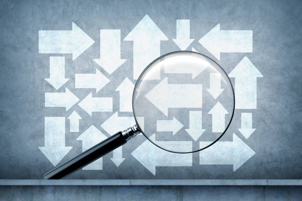 istock Magnifying Glass In Front Of Arrows 1475412832