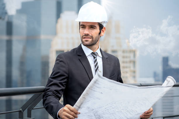 istock Architect man wears white safety helmet check building structure for maintenance repair project plan 1475415231