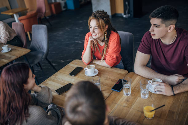 istock People sitting in cafe 1475415395
