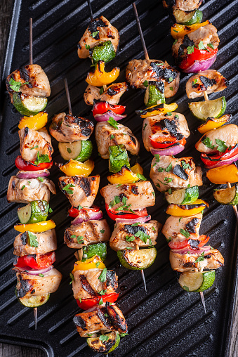 Grilled Kebabs on Cast Iron with Chicken, Bell Peppers, Zucchini and Onion