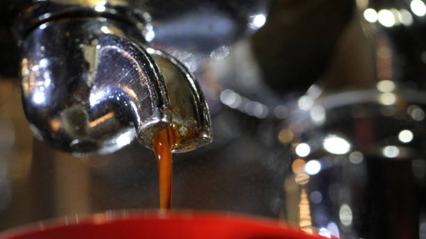 istock Espresso shot extreme close up from underneath looking up at handle and portafilter 1475424169