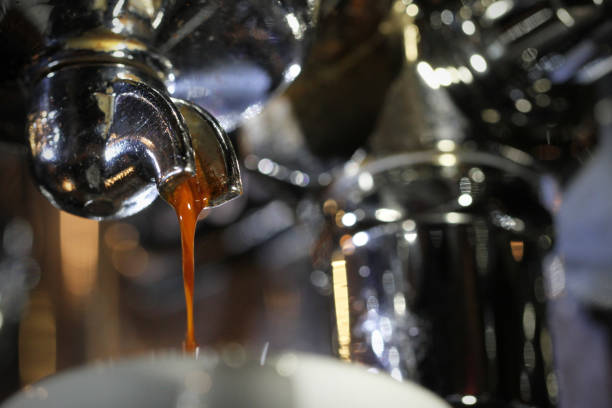 istock Espresso shot extreme close up from underneath looking up at handle and portafilter 1475424176