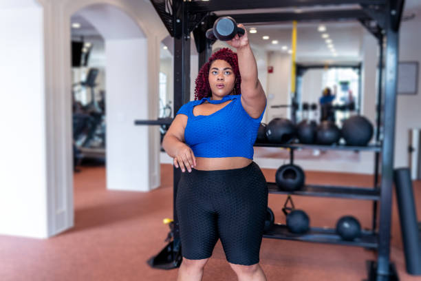 istock Woman doing a kettlebell workout at the gym 1475425976