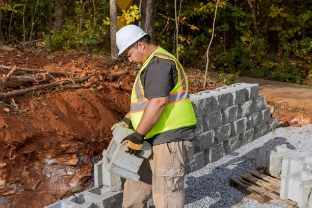 istock A construction worker was working on a construction site near a new home when he was installing a concrete block as part of a retaining wall 1475428062