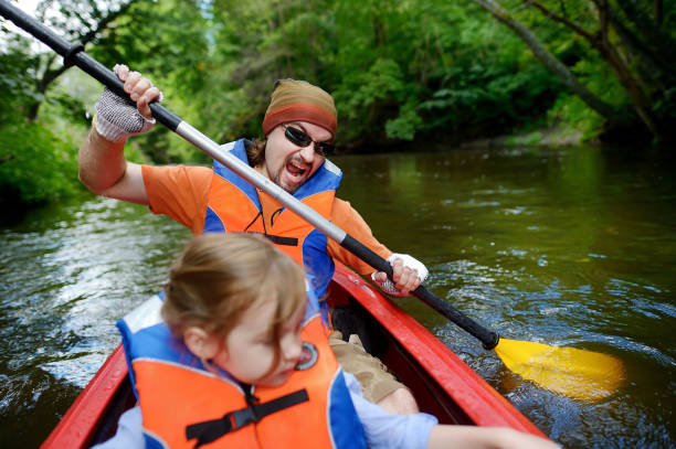 istock Young father and a child kayaking on a sunny summer day 1475429252