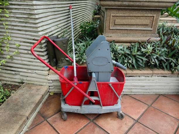 istock Wringer mop bucket down press cleaning janitor trolley. 1475429420
