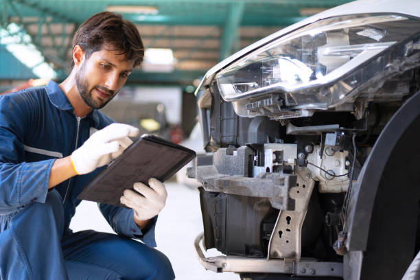 istock Young entrepreneur work at car garage. 1475430289