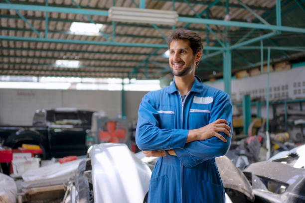 istock Young entrepreneur work at car garage. 1475430352