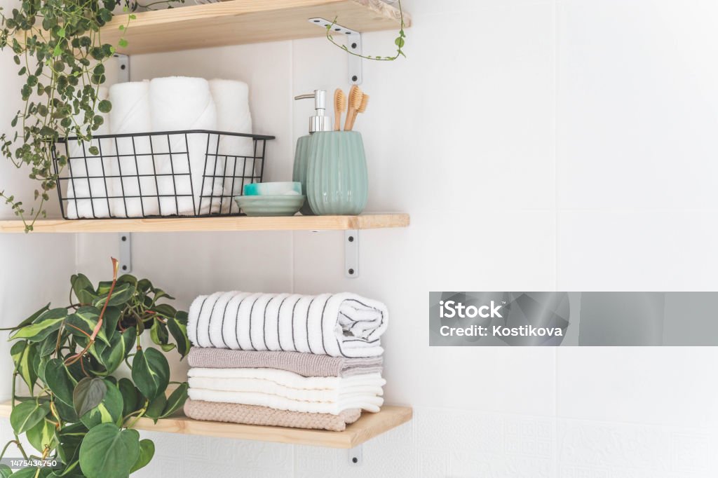Beautiful White Bathroom Wooden Shelves Rolled Towels Stacked