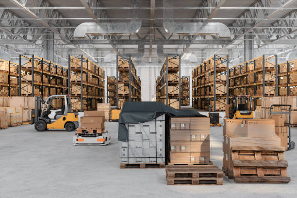 Warehouse Interior With Automated Guided Vehicles, Forklifts, Pallets And Cardboard Boxes stock photo