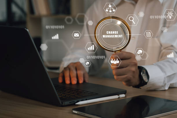 istock Businessman using a computer to document Change management in organization and business concept with consultant presenting icons of strategy. Organizational transition and transformation 1475438715