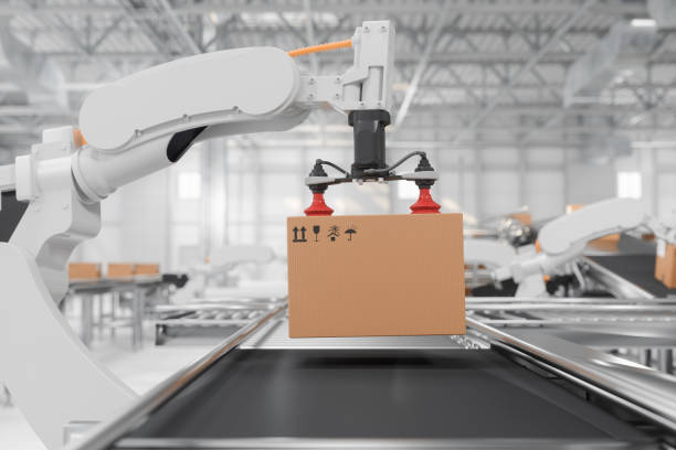 side view of robotic arm carrying carton box on conveyor belt in smart distribution warehouse - assemblagelijn fotos stockfoto's en -beelden
