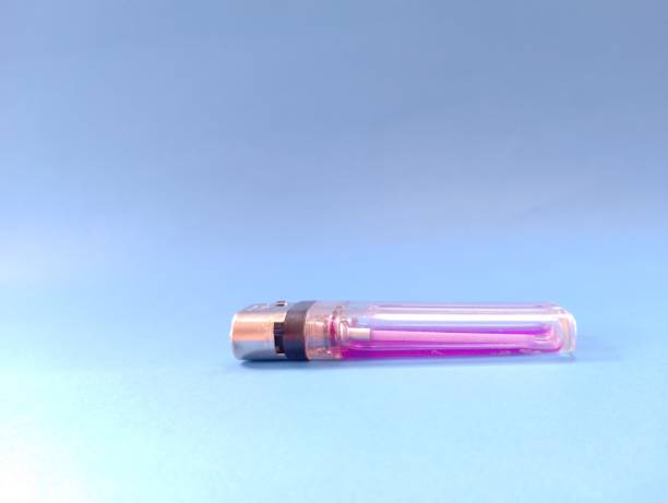 istock purple lighter isolated on blue background 1475445551