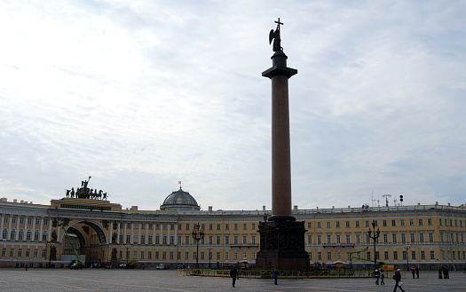 Palace Square, gloomy cloudy day scene, Alexandrian Column in the foreground and General Staff Building in background, St. Petersburg, Russia