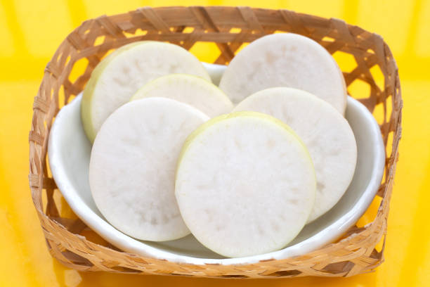 istock Sliced Japanese daikon. Fresh vegetables 1475448136