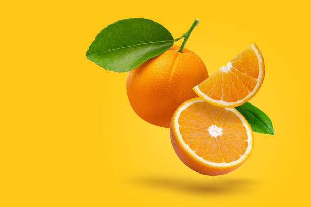 istock Creative layout made from fresh orange fruit on a pastel orange background. Fruit minimal concept and copy space. 1475451617