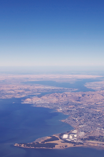 coastal cities from above-east bay contra costa county, california with solano county in the background, during a dry summer