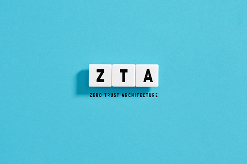 White letter blocks on blue background with the acronym ZTA Zero Trust Architecture. network security concept.