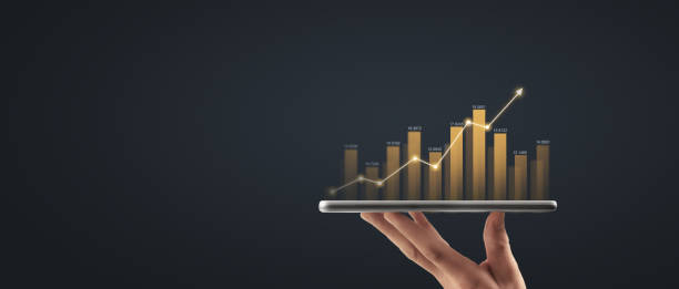 istock Hand holding smartphone device and touching screen. Stock exchange market concept 1475454991