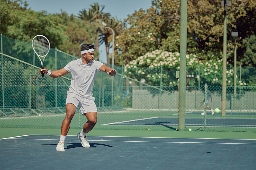 Concentrated mature man, tennis player in motion during game, servign ball with racket. 3d render court, open air arena. Concept of professional sport, game, match, competition, hobby, ad