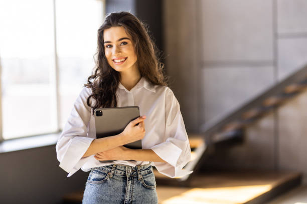 istock Attractive young woman working on a tablet in a home office. 1475462547