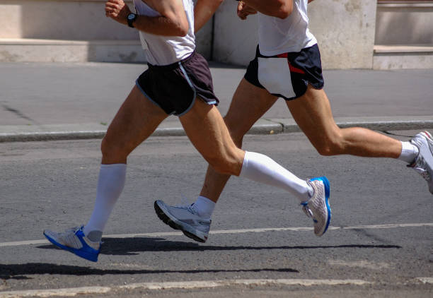 istock Pair of Marathon Runners in Flight 1475462596