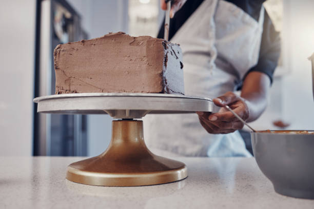 istock Hand, cake and cooking with a man chef working in a kitchen while preparing dessert for a party celebration. Food, chocolate and cherries with a male at work in a bakery to make gourmet confectionary 1475464581