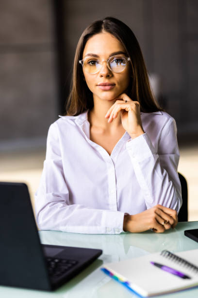 istock Beauitul young woman working using laptop concentrated and smiling 1475474307
