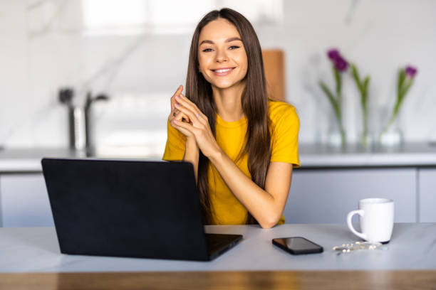 istock Young woman working at home in the morning with laptop 1475475507