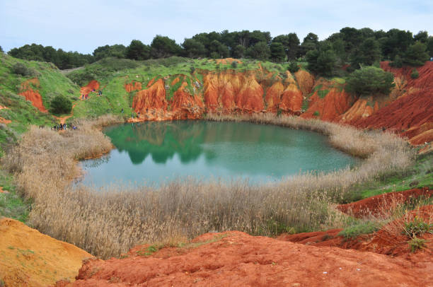 istock Colorful Bauxite Cave Lake in Salento, Southern Italy 1475475590