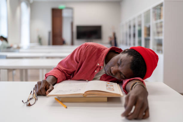 Tired Library 310+ Sleeping People Laziness Library Stock Photos, Pictures & Royalty ...